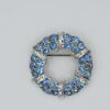 BRO-00001 (15) Light Blue Rhinestone Wreath Brooch | Silver Tone