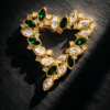 Monet Green and Clear Rhinestone Open Heart Brooch in Gold Tone
